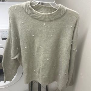 Light grey sweater with pearl detail